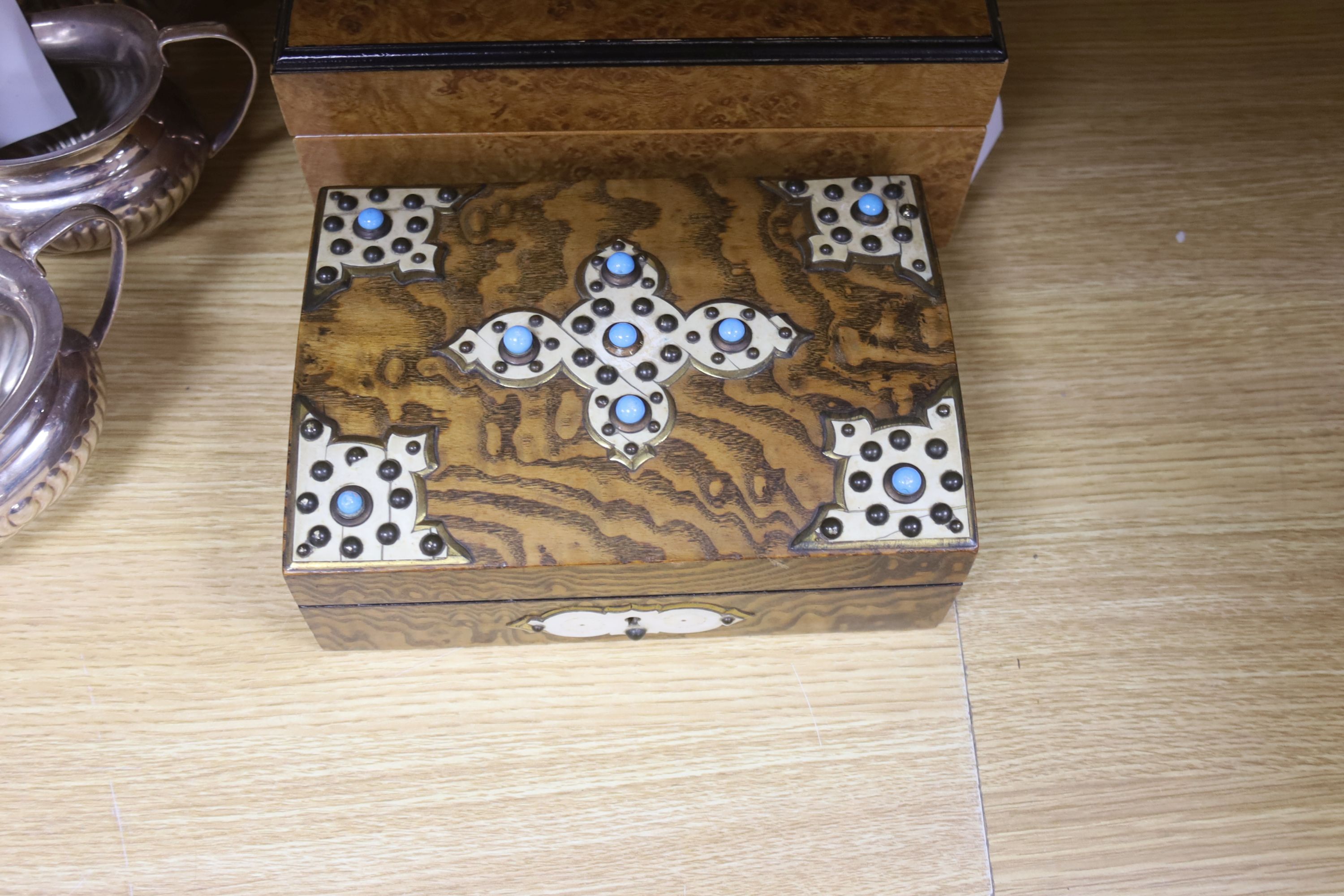 A Victorian studded box, a modern humidor, two candlesticks and a four piece silver plated tea set